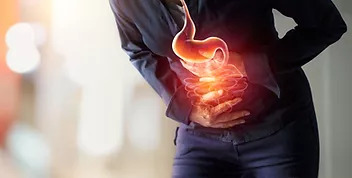 person clutching their stomach with an illustration of stomach pain superimposed on top