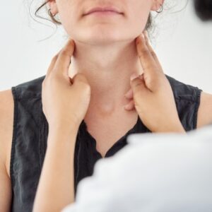 Doctor Feeling Patients Neck For Thyroid Issues