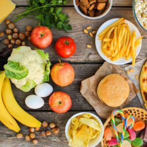 Table With Healthy Foods On Left And Junk Food On Right