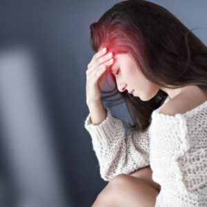 Picture of adult woman suffering from headache at home