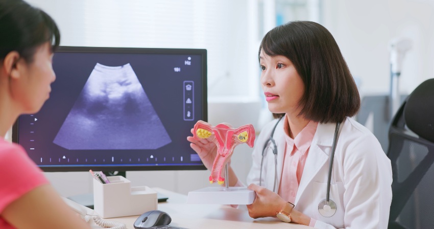 A woman gazes at a computer displaying information on cervical cancer prevention in San Diego, CA