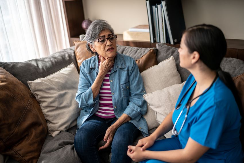 A woman discusses thyroid health issues with a medical professional in San Diego, CA
