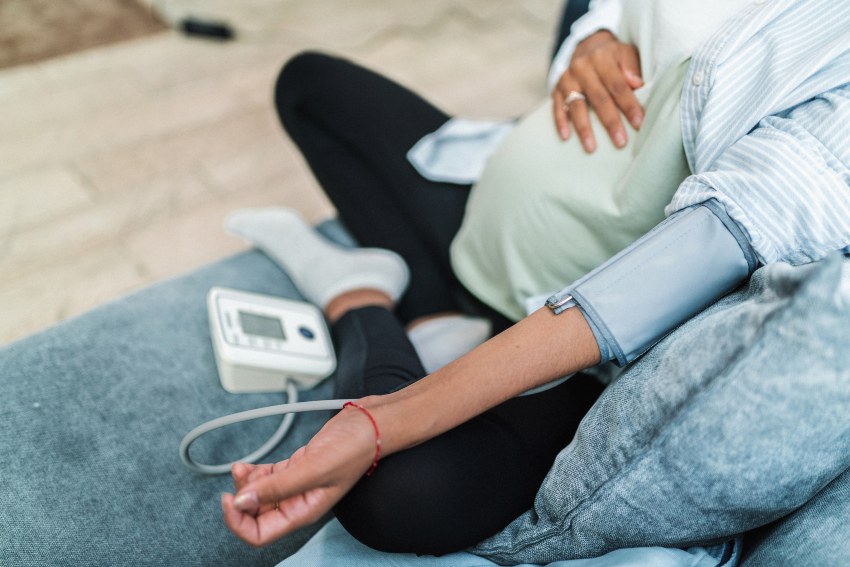 A woman sitting reflecting on high blood pressure in pregnancy in San Diego, CA